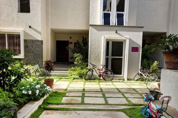 A villa front garden at Vaishnavi Orchids